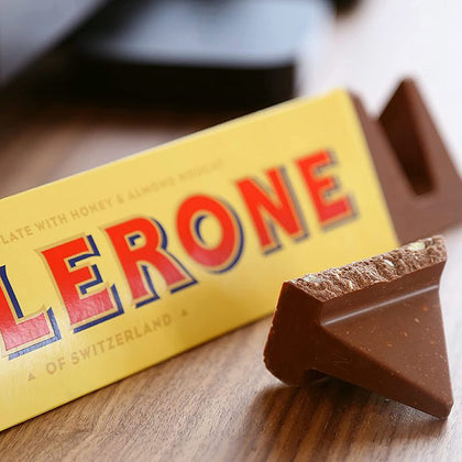 Toblerone Barras de Caramelo, Chocolate Suizo, Turrón de Miel y Almendra, 24 barras